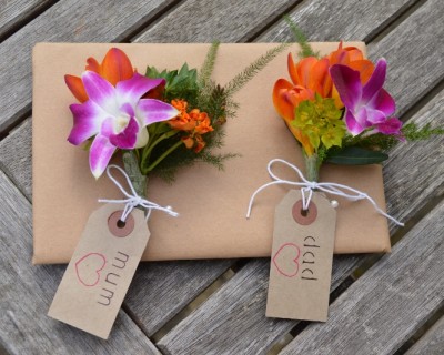Corsages with orange, green and pink flowers - Surrey