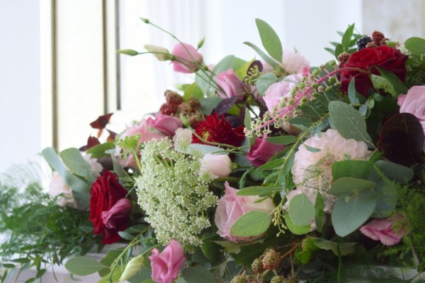 dusky pink and burgundy wedding mantelpiece arrangement