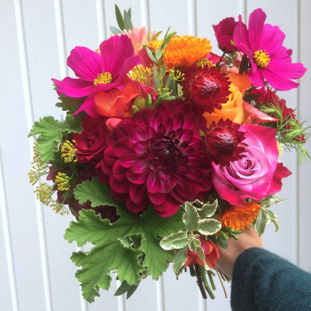 deep pink dahlia and orange bridal bouquet