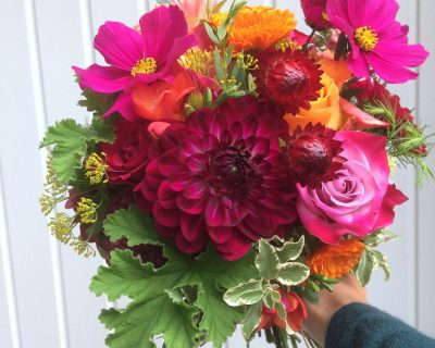 deep pink dahlia and orange bridal bouquet