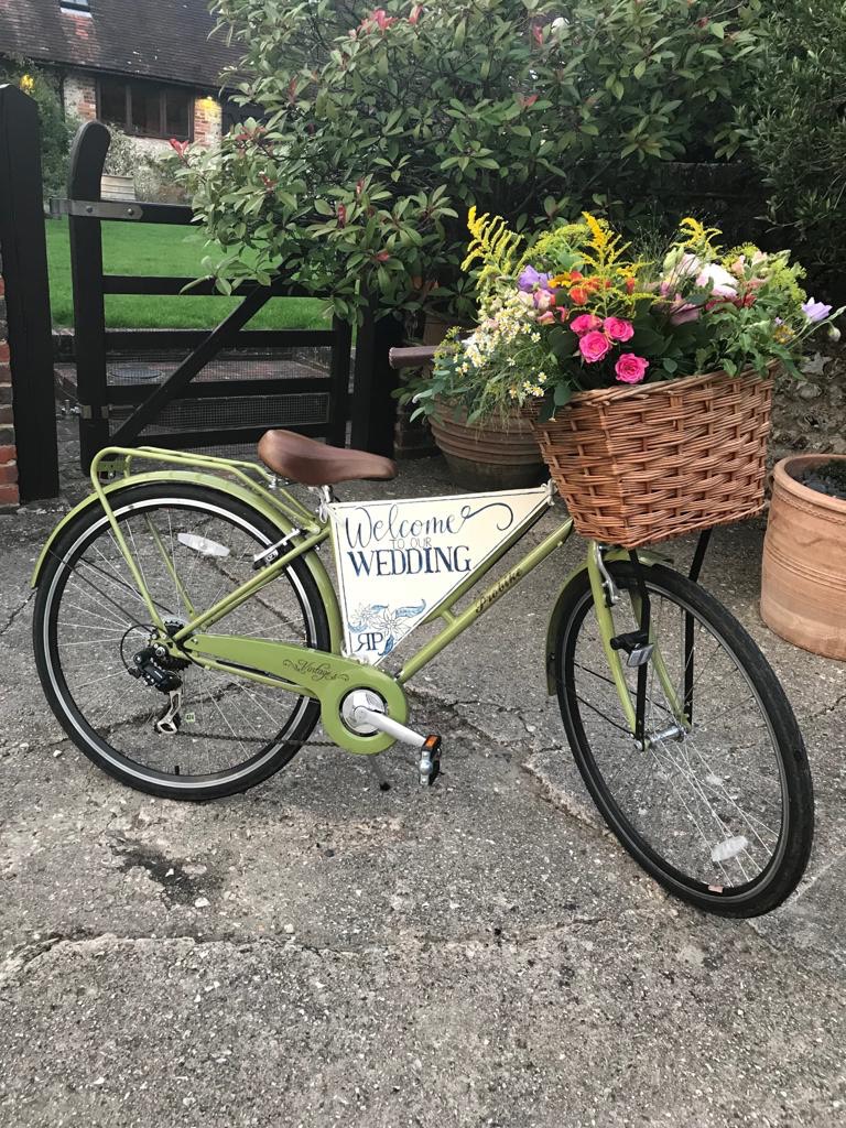 vintage bike with flowers in the basket for a wedding