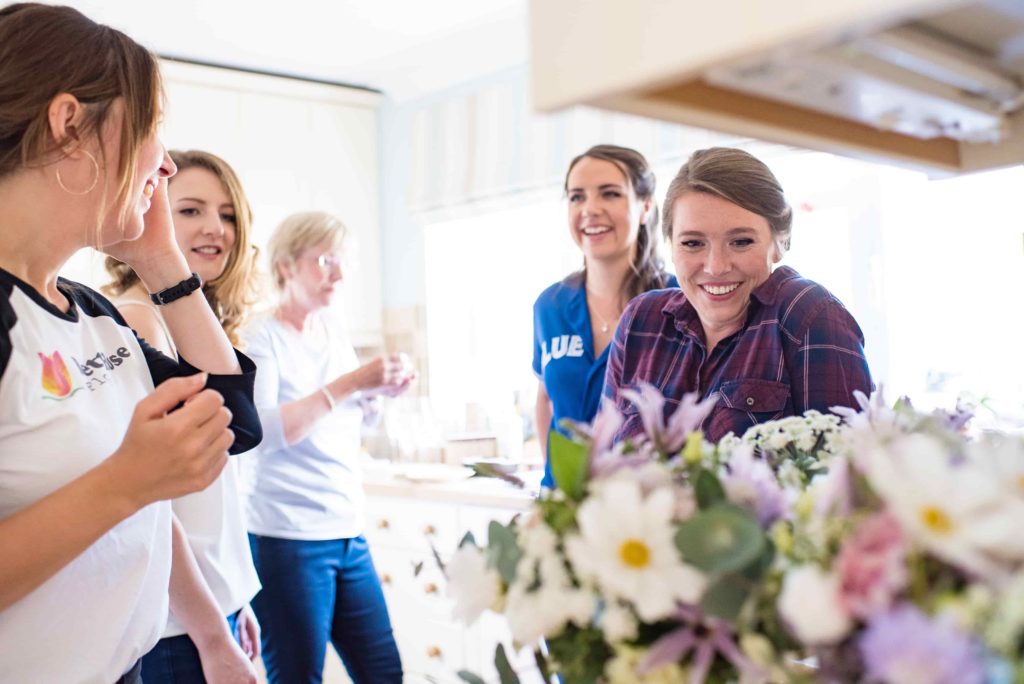 Bettie Rose Flowers delivering a bridal bouquet