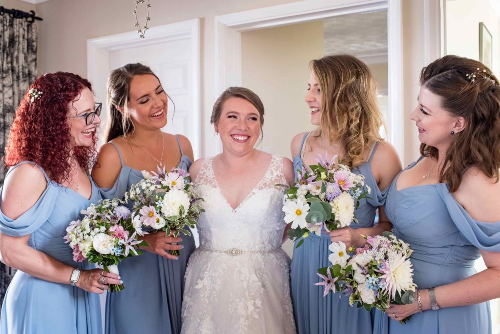 Bridesmaids in duck egg blue dresses at Pangdean barn Brighton 