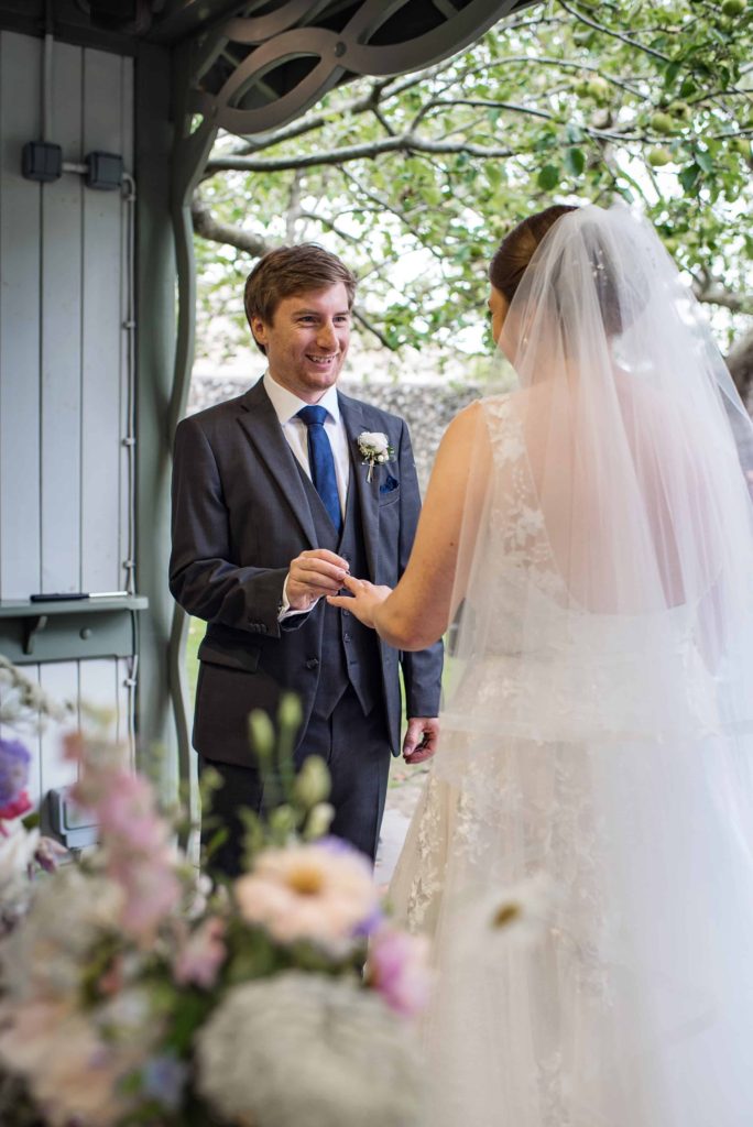 Bride and groom having an outdoor ceremony at Pangdean Barn Brighton