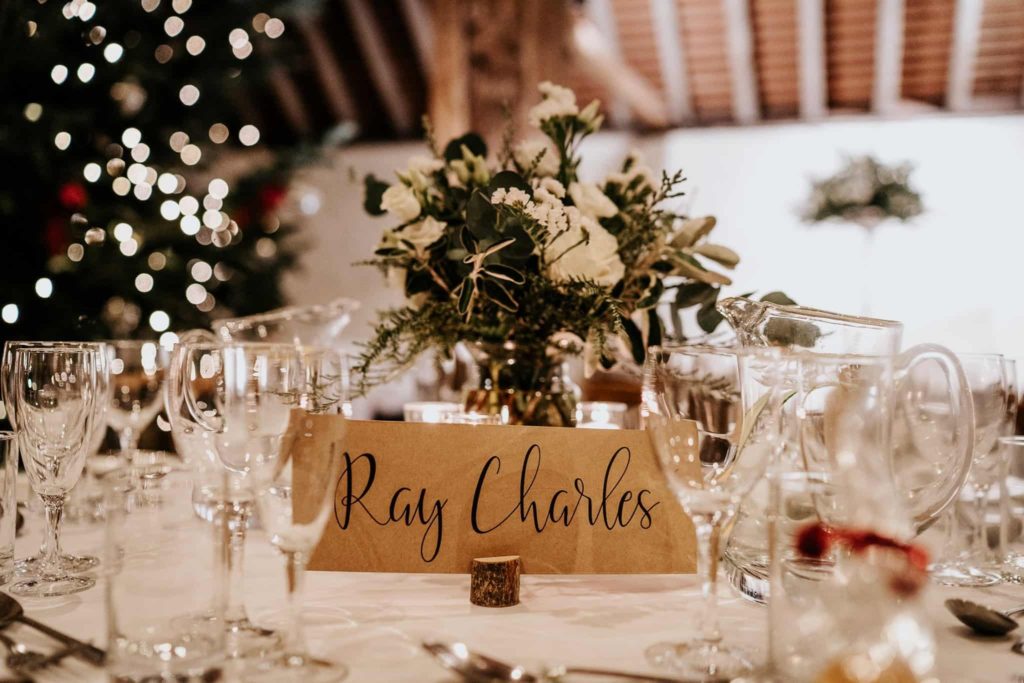 White flower table centres at Pangdean Barn Christmas wedding