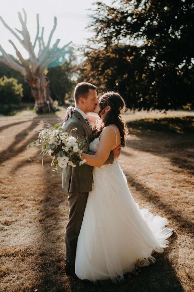 bride and groom in the gardens at chafford park estate, Kent